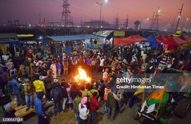 Farmers celebrate Lohri festival amid the ongoing protest against the new farm laws, at Ghazipur on January 13, 2021 in New Delhi, India.