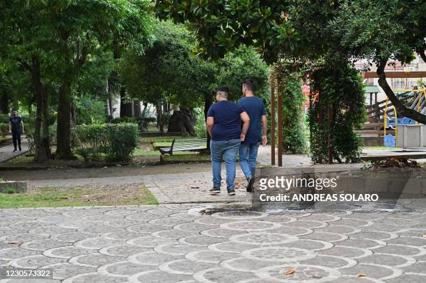 Boys walk at the Villa Comunale in the town of Cinquefrondi in Calabria region in south Italy, on July 6, 2020. - Italian juvenile judge Roberto Di...