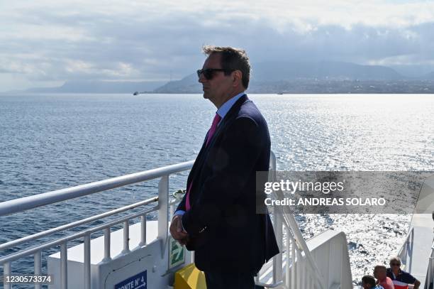 Italian judge Roberto Di Bella stands on a ferry bound to Reggio Calabria during a crossing of the Messina strait on July 7, 2020. - Italian juvenile...