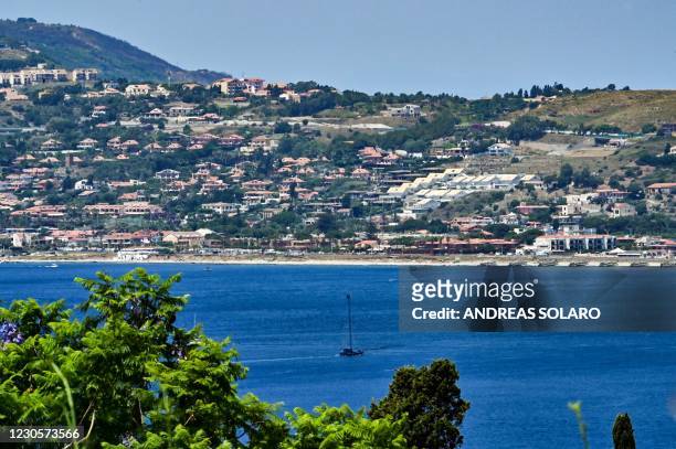 General view shows a boat for swordfish fishing in the Sicilian coast towards Cape Torre Faro, over the Strait of Messina, taken from the outskirts...