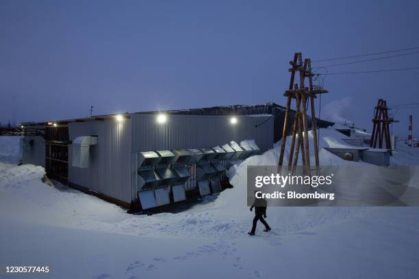 The BitCluster cryptocurrency mining farm partially covered by deep snowfall in Norilsk, Russia, on Sunday, Dec. 20, 2020. Norilsk may soon be famous...