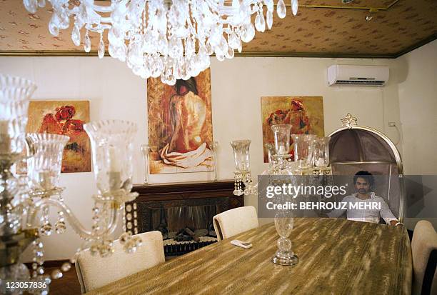 Pakistani interior designer, Muhammad Hamza Tarar poses for a... News ...