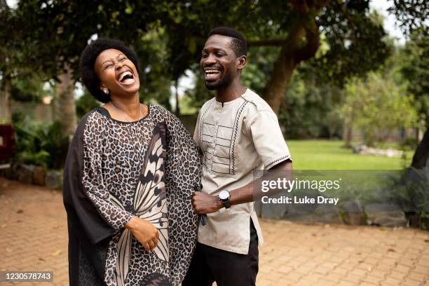 Opposition candidate, Bobi Wine and wife Barbara Itungo Kyagulanyi laugh during the Ugandan presidential elections on January 14, 2021 in Kampala,...
