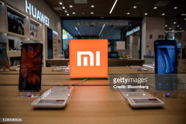 Xiaomi Corp. Mi smartphones on display inside the AliExpress plaza retail store, operated by Alibaba Group Holding Ltd., in Barcelona, Spain, on...