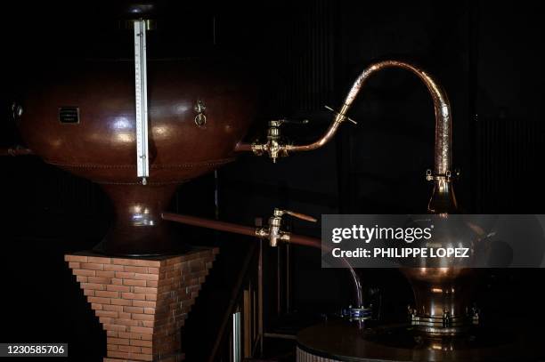 This picture taken on January 14, 2021 shows a detail of an alambic Charentais used for the making of Cognac, a white wine eau-de-vie obtained from a...