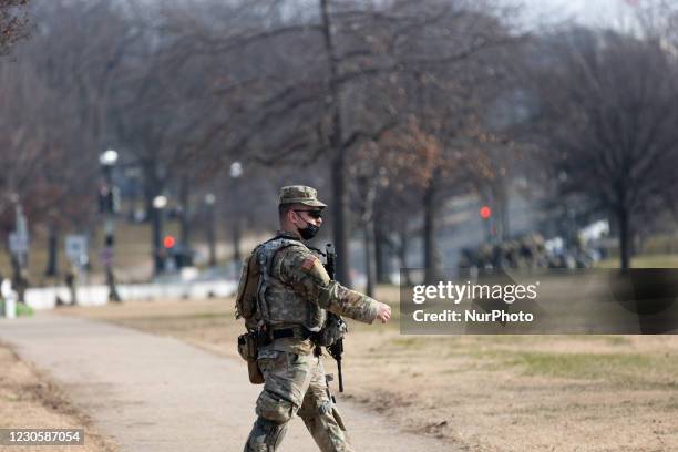 Member of the National Guard is seen at the US Capitol a day after The House of Representatives impeached President Trump for inciting an...