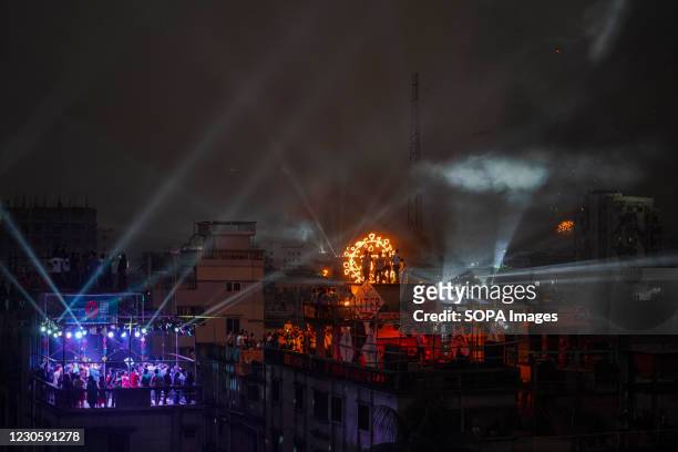 Bangladeshi people set up party lights and perform dance on a rooftop to celebrate Shakrain during Shakrain festival or the Kite festival. Shakrain...