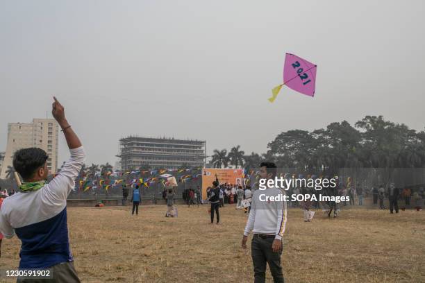 Boy prepares to fly a kite on the occasion of Shakrain festival. Shakrain Festival also known as Kite festival is an annual celebration of winter in...