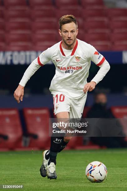 Ivan Rakitic of Sevilla runs with the ball during the La Liga Santander match between Atletico de Madrid and Sevilla FC at Estadio Wanda...