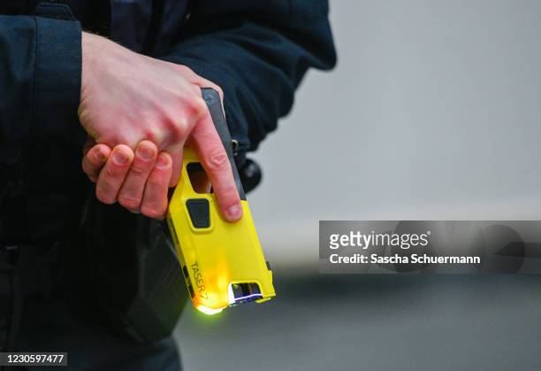 Police officer demonstrates the handling of an Taser on January 15, 2021 in Dortmund, Germany. Police in North Rhine-Westphalia will begin using the...