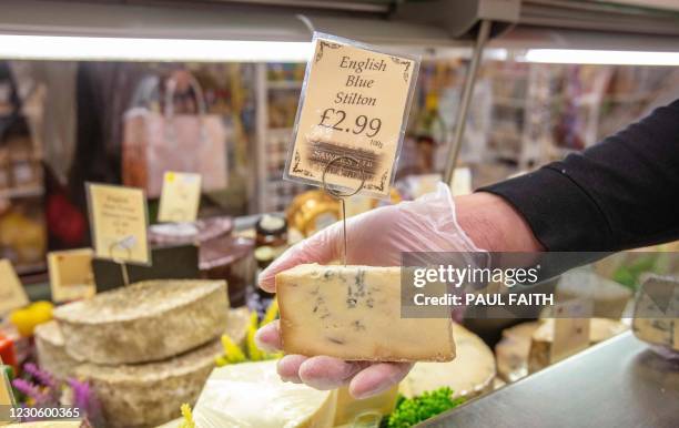 English Blue stilton cheese is seen on sale in Sawers Deli in Belfast, Northern Ireland on January 15, 2021.