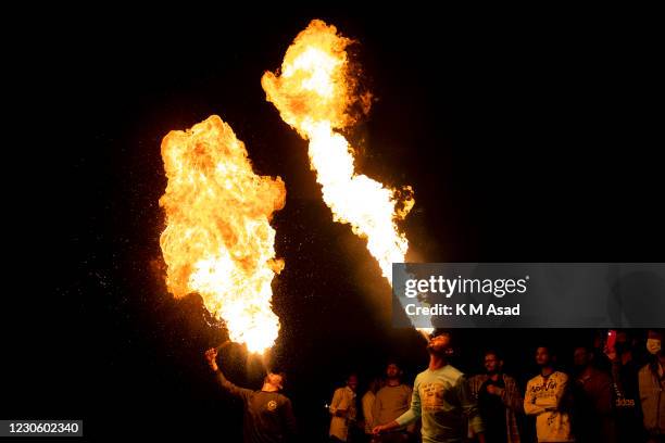 Bangladeshis breathe fire during celebrations for poush Sankranti at old Dhaka in Bangladesh. Shakrain Festival is an annual celebration in Dhaka,...