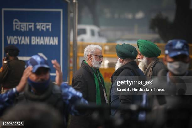 Farmer leaders arrive for the 9th round of talks with Central government over the new farm laws at Vigyan Bhawan, on January 15, 2021 in New Delhi,...