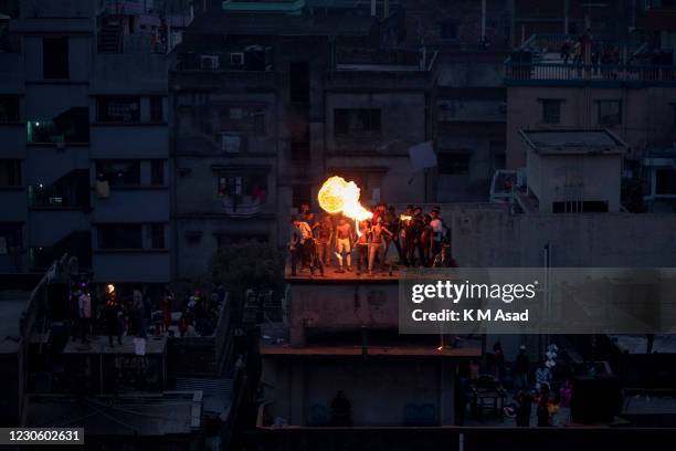 Bangladeshi breathes fire during celebrations for poush Sankranti at old Dhaka in Bangladesh. Shakrain Festival is an annual celebration in Dhaka,...