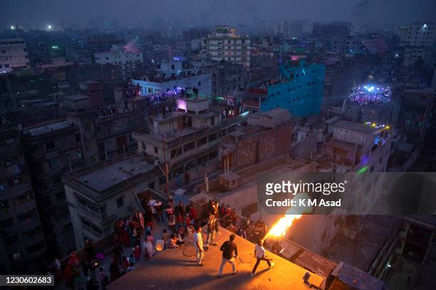 Bangladeshi breathes fire during celebrations for poush Sankranti with different activities at old Dhaka in Bangladesh. Shakrain Festival is an...