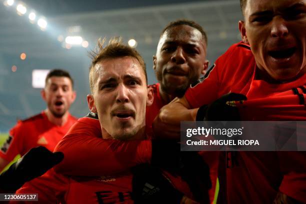 Benfica's Spanish defender Alex Grimaldo celebrates with teammates Benfica's Portuguese midfielder Pizzi, Benfica's Portuguese defender Nuno Tavares...