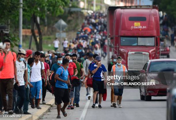Migrants heading to the border with Guatemala on their way to the United States, march in La Entrada, in the Honduran department of Copan, on January...