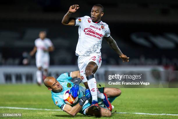 Enrique Palos of FC Juarez and Fabian Castillo of Tijuana compete for the ball during the 2nd round match between FC Juarez and Club Tijuana as part...