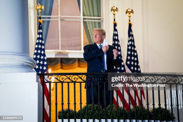 President Donald J. Trump watches Marine One from the Truman Balcony as he returns home after receiving treatments for the covid-19 coronavirus at...