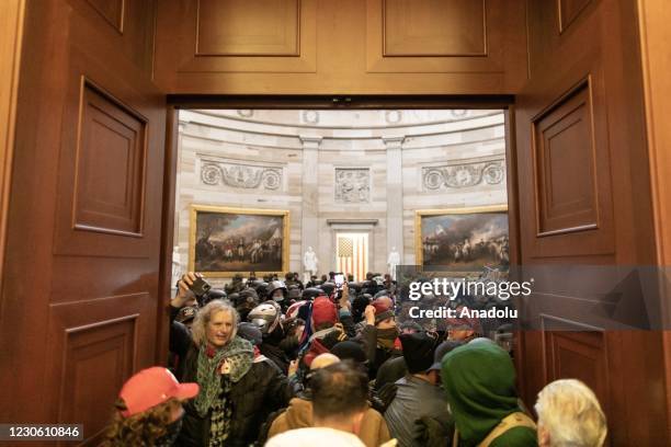 Police intervenes in US President Donald Trumps supporters who breached security and entered the Capitol building in Washington D.C., United States...