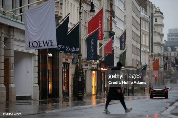 Pedestrians walk along New Bond Street in Mayfair on January 16 in London, England. With a surge of COVID-19 cases fuelled partly by a more...