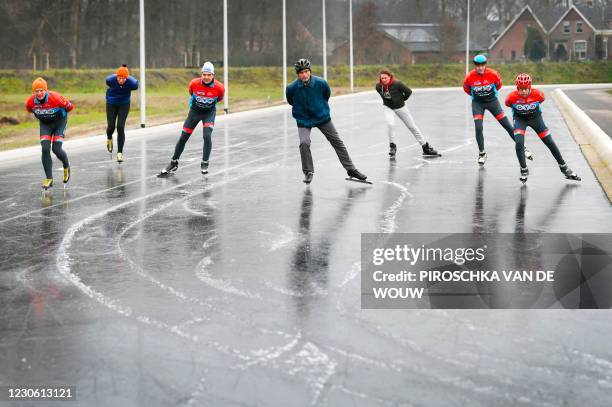 Skaters test the ice on the track of the 'Winterswijkse IJsvereniging' or Ice Association after a special sprinkler system makes it possible to skate...