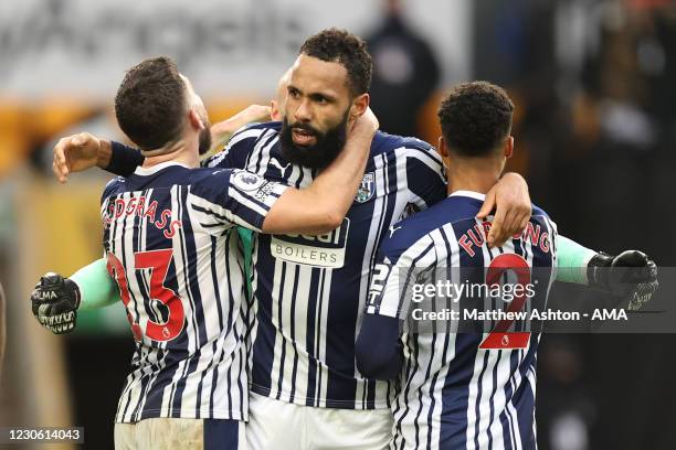 Kyle Bartley of West Bromwich Albion celebrates with Robert Snodgrass and Darnell Furlong of West Bromwich Albion at full time during the Premier...