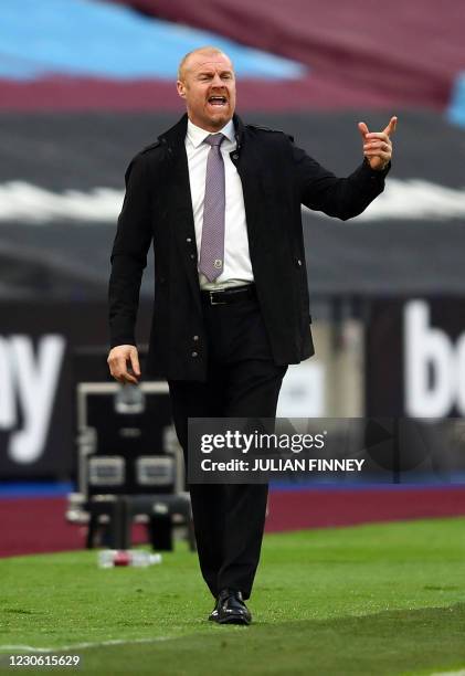 Burnley's English manager Sean Dyche gestures during the English Premier League football match between West Ham United and Burnley at The London...