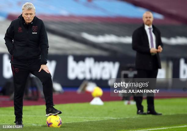 West Ham United's Scottish manager David Moyes and Burnley's English manager Sean Dyche watch during the English Premier League football match...