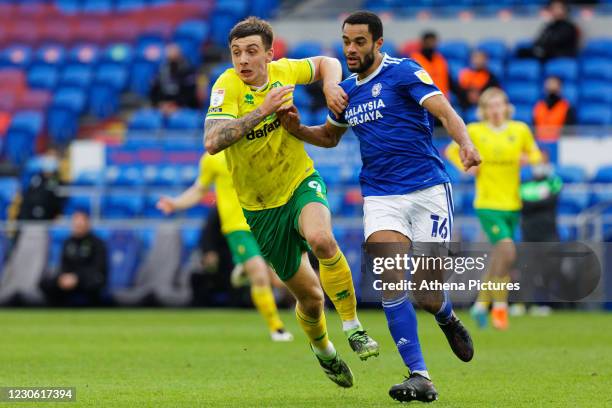 Jordan Hugill of Norwich City and Curtis Nelson of Cardiff City in action during the Sky Bet Championship match between Cardiff City and Norwich City...