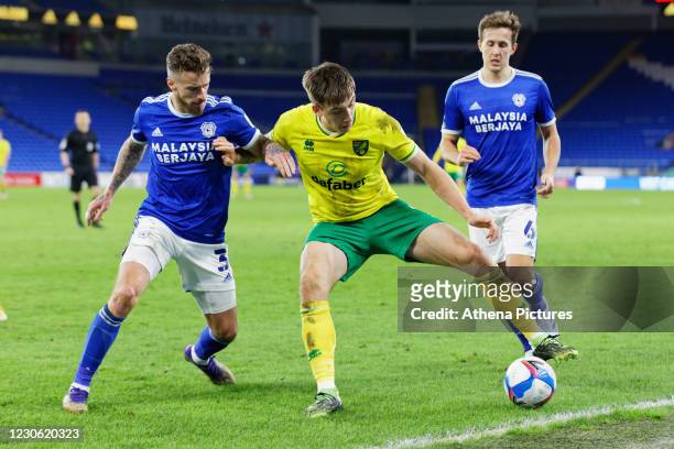 Jordan Hugill of Norwich City challenged by Joe Bennett of Cardiff City during the Sky Bet Championship match between Cardiff City and Norwich City...