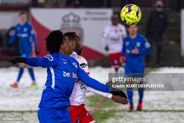 Genk's Angelo Preciado and Mouscron's Fabrice Olinga fight for the ball during a soccer match between Royal Excel Mouscron and KRC Genk, Saturday 16...