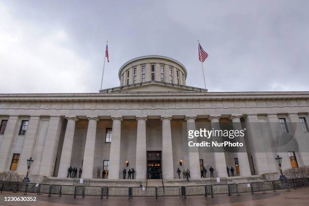 Troopers from the Ohio State Patrol and soldiers from the Ohio National Guard guard the Ohio Statehouse as the threat of violence from armed protests...