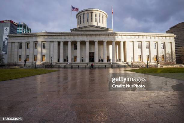 Troopers from the Ohio State Patrol and soldiers from the Ohio National Guard guard the Ohio Statehouse as the threat of violence from armed protests...