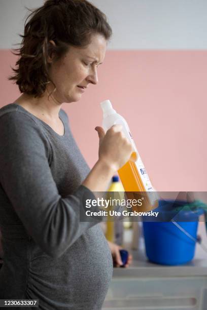 Bonn, Germany In this photo illustration a pregnant woman smells a cleaning product the on January 14, 2021 in Bonn, Germany.