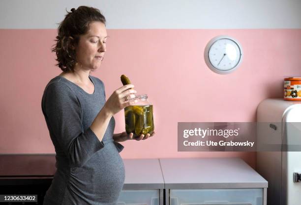 Bonn, Germany In this photo illustration a pregnant woman eats pickleson January 14, 2021 in Bonn, Germany.