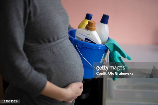 Bonn, Germany In this photo illustration is a pregnant woman with cleaning bucket on January 14, 2021 in Bonn, Germany.