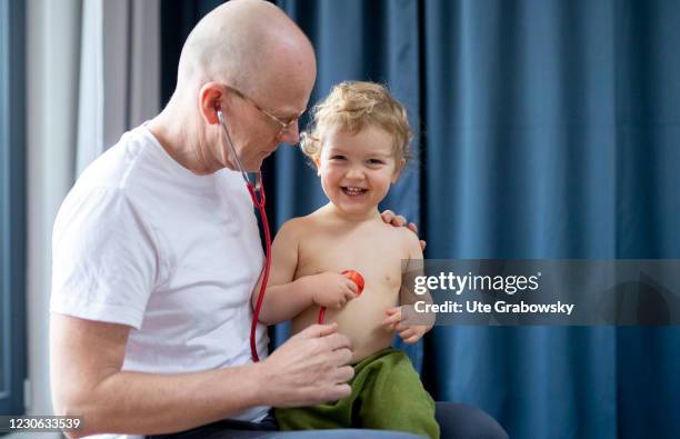 Bonn, Germany In this photo illustration a doctor examines a toddler on January 14, 2021 in Bonn, Germany.