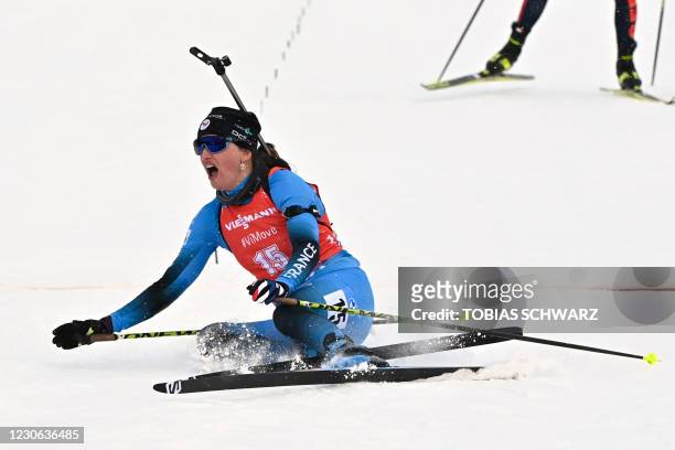 France's Julia Simon reacts after crossing the finish line to win the women's 12.5km mass start event of the IBU Biathlon World Cup in Oberhof,...