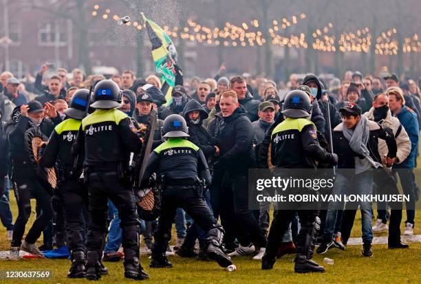 Riot police clashes with protesters during a demonstration in the Museumplein town square in Amsterdam, Netherlands, on January 17, 2021. - The...