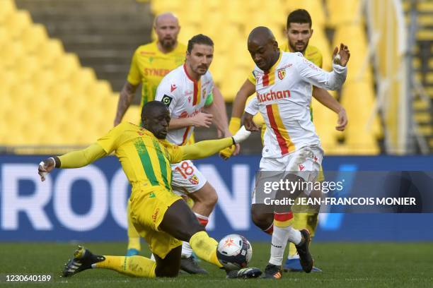 Nantes' French midfielder Abdoulaye Toure fights for the ball with Lens' French Congolese defender Gael Kakuta during the French L1 Football match...