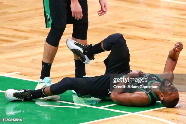 Kemba Walker of the Boston Celtics suffers an apparent injury during a game against the New York Knicks at TD Garden on January 17, 2021 in Boston,...
