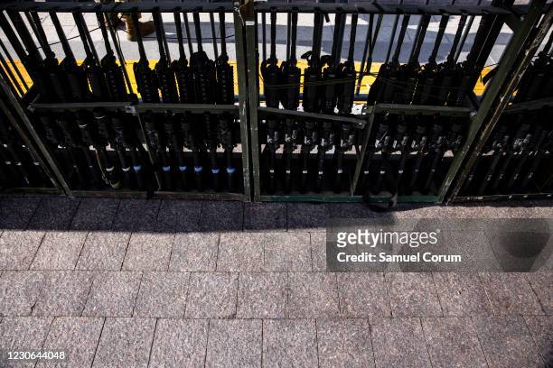Racks of M4 rifles wait to be issued to Virginia National Guard soldiers on the east front of the U.S. Capitol on January 17, 2021 in Washington, DC....