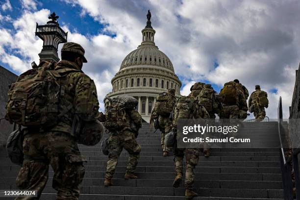 National Guard soldier head to the east front of the U.S. Capitol from the Capitol Visitors Center on January 17, 2021 in Washington, DC. After last...