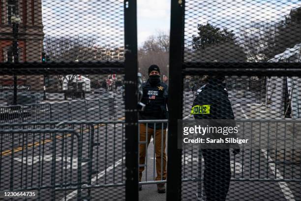 Members of the Secret Service guard the expanded protective perimeter around the White House on January 17, 2021 in Washington, DC. As a result of...