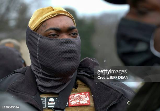 Members of United Pharaohs Guard, a left wing militia, stand in front of the state capitol building in Frankfort, Kentucky, on January 17 during a...