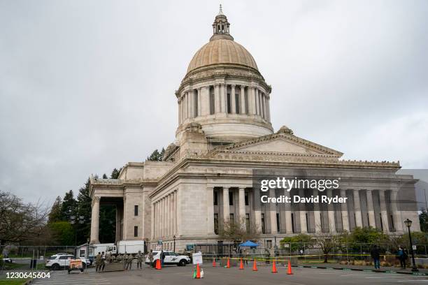 Washington State Patrol and Washington National Guard personnel keep watch at the Washington State Capitol on January 17, 2021 in Olympia,...