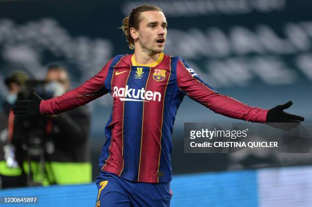 Barcelona's French midfielder Antoine Griezmann celebrates his team's second goal during the Spanish Super Cup final football match between FC...