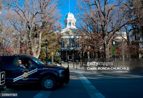 Nevada Highway Patrol vehicle passes by the State Capitol on January 17 in Carson City, Nevada during a nationwide protest called by anti-government...