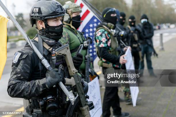 Members of the far-right extremist movement Boogaloo Bois, stage a demonstration at Oregons State Capitol in Salem, Oregon, United States on January...